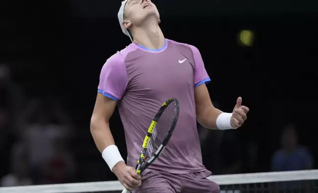 Denmark's Holger Rune reacts during the semifinal match of the Paris Masters tennis tournament against Germany's Alexander Zverev at the Accor Arena on Saturday, Nov. 2, 2024, in Paris. (AP Photo/Thibault Camus)