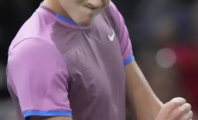 Denmark's Holger Rune reacts shortly before defeating Alex de Minaur, of Australia, during their quarterfinal match of the Paris Masters tennis tournament at the Accor Arena, Friday, Nov. 1, 2024 in Paris. (AP Photo/Michel Euler)