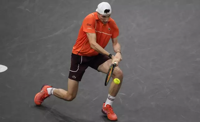 France's Ugo Humbert returns the ball to Spain's Carlos Alcaraz during their third round match at the Paris Masters tennis tournament at the Accor Arena, Thursday, Oct. 31, 2024 in Paris. (AP Photo/Michel Euler)