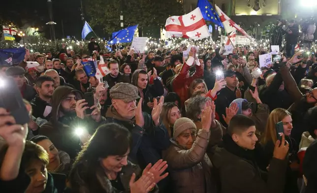 People attend a rally to protest against alleged violations in a recent parliamentary election in Tbilisi, Georgia, Monday, Nov. 11, 2024. (AP Photo/Zurab Tsertsvadze)