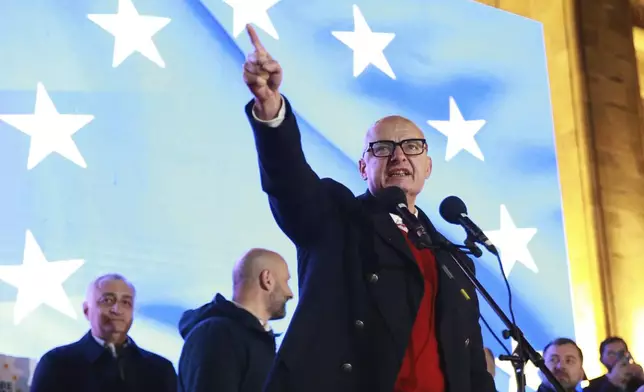 Deputy Marshal of the Senate of Poland Michal Kaminski speaks during a rally, protesting against alleged violations in a recent parliamentary election in Tbilisi, Georgia, Monday, Nov. 11, 2024. (AP Photo/Zurab Tsertsvadze)