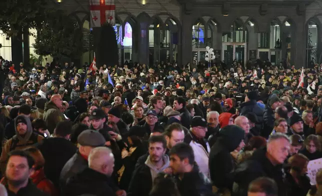 People attend a rally to protest against alleged violations in a recent parliamentary election in Tbilisi, Georgia, Monday, Nov. 11, 2024. (AP Photo/Zurab Tsertsvadze)