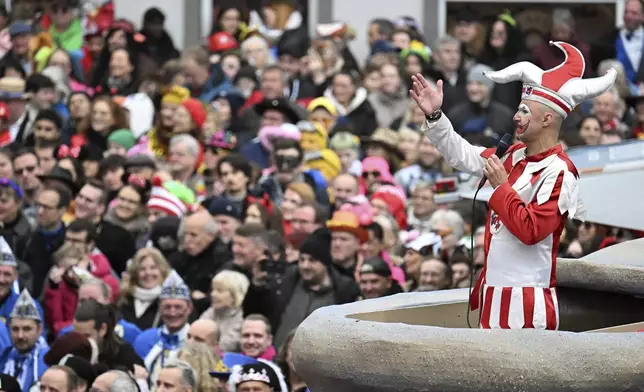 The Duesseldorf carnival figure "Hoppeditz" awakens on the market square for the start of the carnival, in Duesseldorf, Germany, Monday Nov. 11, 2024. (Federico Gambarini/dpa via AP)