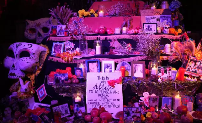 Latino community display offerings for the Day of the Dead in Berlin, Germany, Friday, Nov. 1, 2024. (AP Photo/Ebrahim Noroozi)