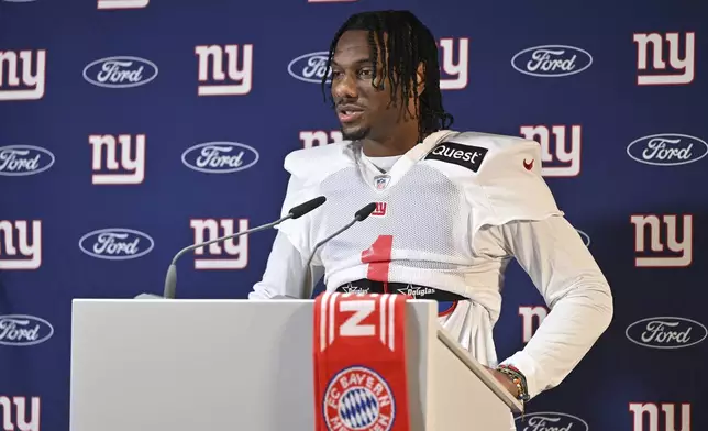 New York Giants wide receiver Malik Nabers (1) attends a news conference after a practice session in Munich, Germany, Friday, Nov. 8, 2024. The New York Giants are set to play the Carolina Panthers in an NFL game at the Allianz Arena in Munich on Sunday. (AP Photo/Lennart Preiss)