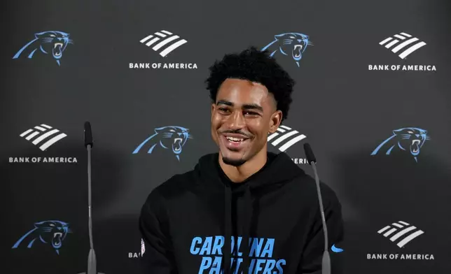 Carolina Panthers quarterback Bryce Young (9) attends a news conference after a practice session in Munich, Germany, Friday, Nov. 8, 2024. The Carolina Panthers are set to play the New York Giants in an NFL game at the Allianz Arena in Munich on Sunday Nov. 10. (AP Photo/Matthias Schrader)