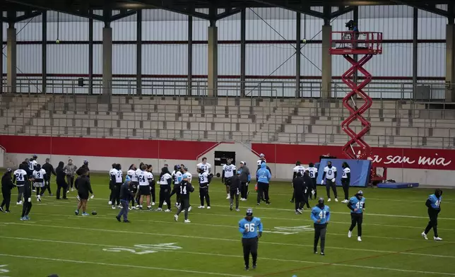 Carolina Panthers players practice during a training session in Munich, Germany, Friday, Nov. 8, 2024. The Carolina Panthers are set to play the New York Giants in an NFL game at the Allianz Arena in Munich on Sunday Nov. 10. (AP Photo/Matthias Schrader)