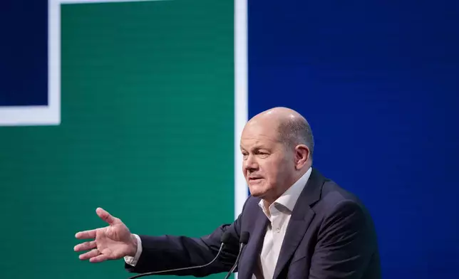 German Chancellor Olaf Scholz speaks to participants at the Deutsche Telekom AG forum, in Berlin, Thursday, Nov. 7, 2024. (Carsten Koall/dpa via AP)