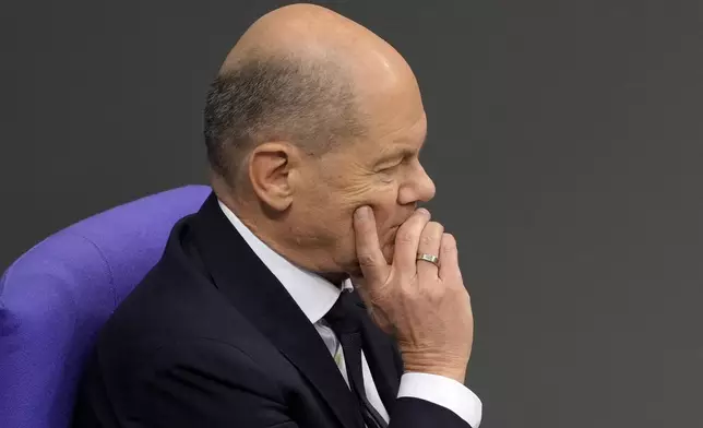 German Chancellor Olaf Scholz attends a plenary session in the German parliament Bundestag in Berlin, Germany, Wednesday, Nov. 13, 2024. (AP Photo/Markus Schreiber)