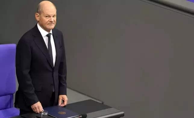 German Chancellor Olaf Scholz attends a plenary session in the German parliament Bundestag in Berlin, Germany, Wednesday, Nov. 13, 2024. (AP Photo/Markus Schreiber)