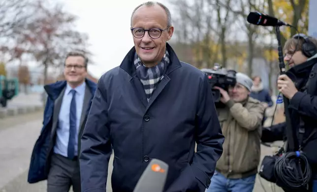 German opposition leader and Christian Union parties floor leader Friedrich Merz arrives for a meeting with German Chancellor Olaf Scholz at the chancellery in Berlin, Thursday, Nov.7, 2024. (AP Photo/Markus Schreiber)