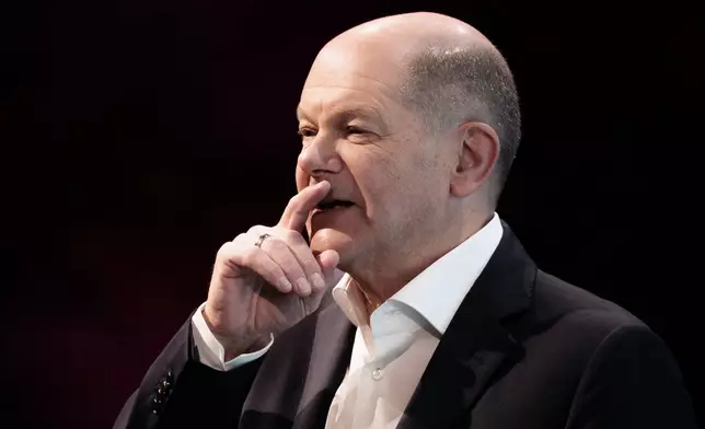 German Chancellor Olaf Scholz speaks to participants at the Deutsche Telekom AG forum, in Berlin, Thursday, Nov. 7, 2024. (Carsten Koall/dpa via AP)