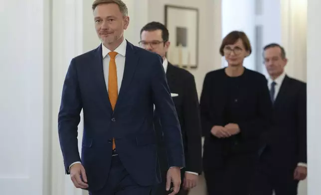 Christian Lindner Germany's former Federal Minister of Finance, Marco Buschmann, former Federal Minister of Justice, Bettina Stark-Watzinger, former Federal Minister of Education and Research, and Volker Wissing, Federal Minister of Digital Affairs and Transport, walk at Bellevue Palace, in Berlin, Thursday, Nov. 7, 2024. (Kay Nietfeld/dpa via AP)