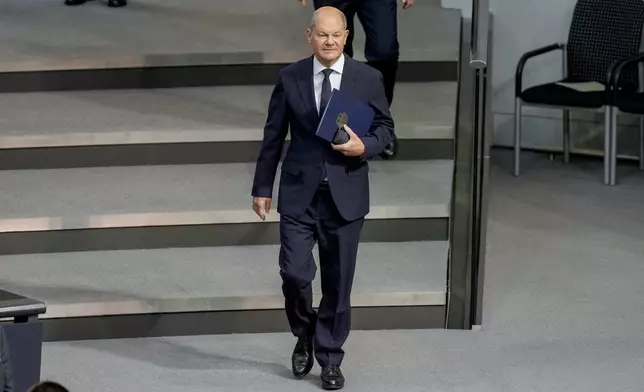 German Chancellor Olaf Scholz attends a plenary session in the German parliament Bundestag in Berlin, Germany, Wednesday, Nov. 13, 2024. (AP Photo/Markus Schreiber)