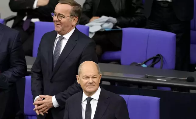 German Chancellor Olaf Scholz, right, and defence minister Boris Pistorius attend a plenary session in the German parliament Bundestag in Berlin, Germany, Wednesday, Nov. 13, 2024. (AP Photo/Markus Schreiber)