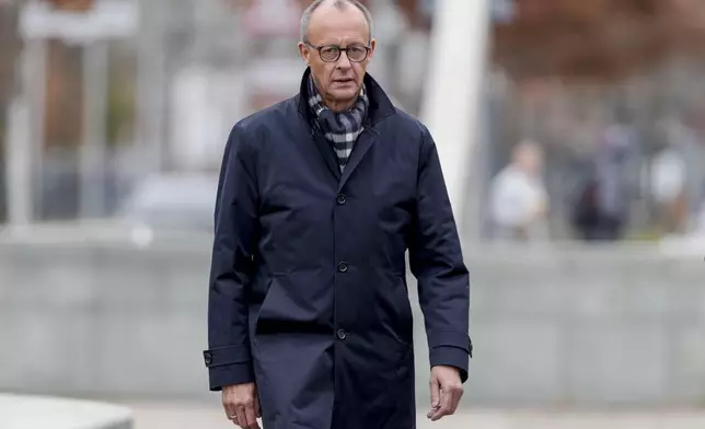 German opposition leader and Christian Union parties floor leader Friedrich Merz arrives for a meeting with German Chancellor Olaf Scholz at the chancellery in Berlin, Thursday, Nov.7, 2024. (AP Photo/Markus Schreiber)