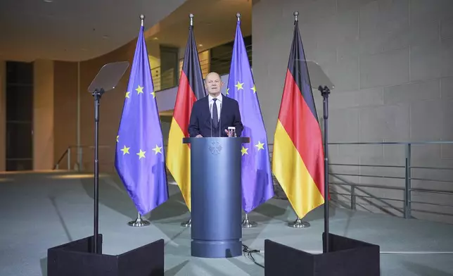 Germany's Federal Chancellor Olaf Scholz speaks in Berlin, Wednesday Nov. 6, 2024. (Michael Kappeler/dpa via AP)