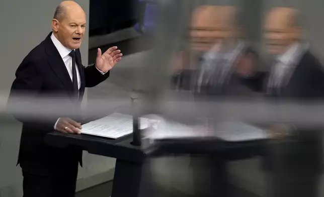 German Chancellor Olaf Scholz delivers his government statement in the German parliament Bundestag in Berlin, Germany, Wednesday, Nov. 13, 2024. (AP Photo/Markus Schreiber)