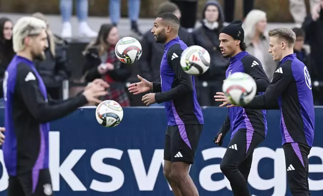 From left, Germany's Robert Andrich, Jonathan Tah, Leroy Sane and Chris Fuhrich attend a training session in Frankfurt, Germany, Monday Nov. 11, 2024, ahead of their Nations League soccer matches. (Uwe Anspach/dpa via AP)