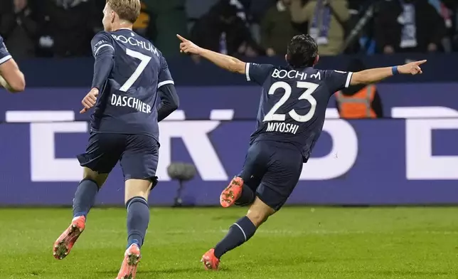 Bochum's Koji Miyoshi celebrates after scoring during the German Bundesliga soccer match between VfL Bochum and Bayer Leverkusen in Bochum, Germany, Saturday, Nov. 9, 2024. (AP Photo/Martin Meissner)