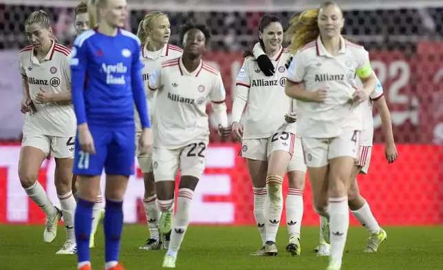 Bayern's Sarah Zadrazil, background right, smiles after scoring her side's third goal during the women's Champions League group C soccer match between FC Bayern Munich and Valerenga at the FC Bayern Campus in Munich, Germany, Tuesday, Nov. 12, 2024. (AP Photo/Matthias Schrader)