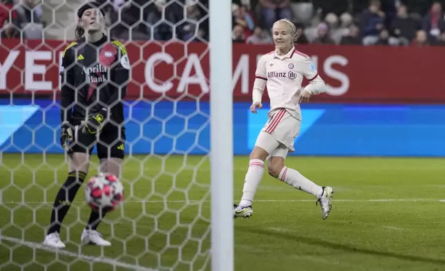 Bayern's Pernille Harder scores the opening goal past Valerenga goalkeeper Tove Enblom during the women's Champions League group C soccer match between FC Bayern Munich and Valerenga at the FC Bayern Campus in Munich, Germany, Tuesday, Nov. 12, 2024. (AP Photo/Matthias Schrader)