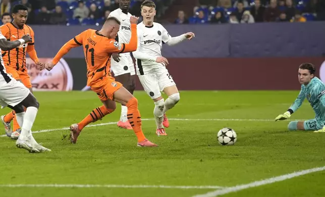 Shakhtar's Oleksandr Zubkov, centre, scores his side's opening goal during the Champions League opening phase soccer match between Shakhtar Donetsk and Young Boys Bern at the Arena AufSchalke in Gelsenkirchen, Germany, Wednesday, Nov. 6, 2024. (AP Photo/Martin Meissner)