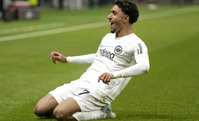 Frankfurt's Omar Marmoush celebrates after scoring the opening goal during the Europa League opening phase soccer match between Eintracht Frankfurt and Slavia Prague in Frankfurt, Germany, Thursday, Nov. 7, 2024. (Thomas Frey/dpa via AP)