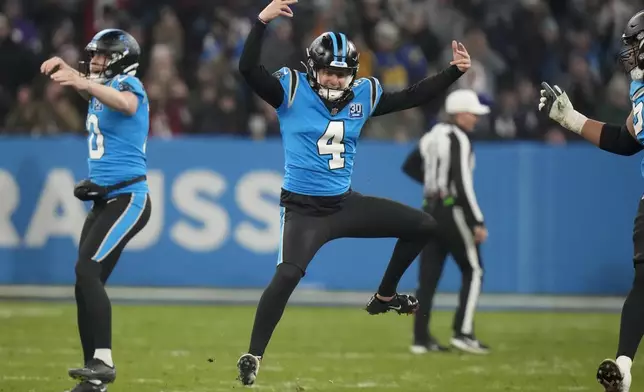 Carolina Panthers kicker Eddy Pineiro celebrates after kicking the game-winning field goal in overtime against New York Giants during an NFL football game, Sunday, Nov. 10, 2024, in Munich, Germany. (AP Photo/Matthias Schrader)