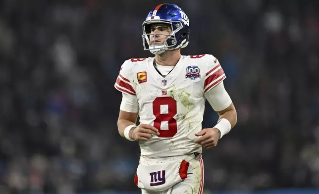 New York Giants quarterback Daniel Jones watches during the second half of an NFL football game against the Carolina Panthers, Sunday, Nov. 10, 2024, in Munich, Germany. (AP Photo/Lennart Preiss)