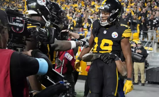 Pittsburgh Steelers wide receiver Calvin Austin III (19) celebrates his touchdown catch with teammates during the second half of an NFL football game against the New York Giants, Monday, Oct. 28, 2024, in Pittsburgh. (AP Photo/Gene J. Puskar)