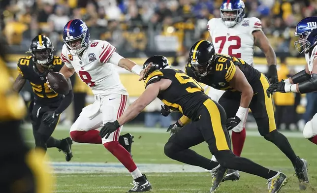 New York Giants quarterback Daniel Jones (8) is sacked by Pittsburgh Steelers linebacker T.J. Watt (90) during the second half of an NFL football game Monday, Oct. 28, 2024, in Pittsburgh. (AP Photo/Matt Freed)