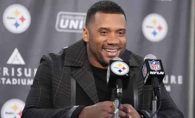 Pittsburgh Steelers quarterback Russell Wilson answers questions after an NFL football game against the New York Giants, Tuesday, Oct. 29, 2024, in Pittsburgh. (AP Photo/Gene J. Puskar)