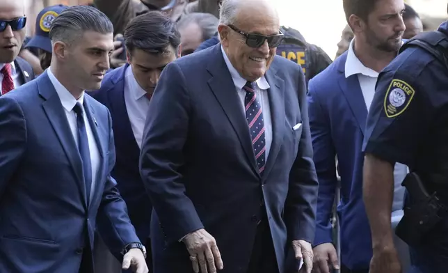 Rudy Giuliani, center, arrives to federal court in New York, Thursday, Nov. 7, 2024. (AP Photo/Seth Wenig)