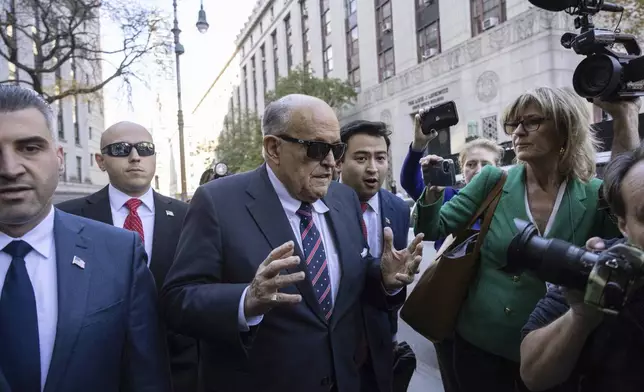 Former New York City Mayor Rudy Giuliani arrives at the court to explain to a federal judge why he hasn't surrendered his valuables as part of a $148 million defamation judgment, in New York, Thursday, Nov. 7, 2024. (AP Photo/Yuki Iwamura)