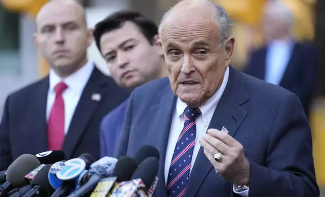 Former New York Mayor Rudy Giuliani speaks the media as he leaves court in New York, Thursday, Nov. 7, 2024. (AP Photo/Seth Wenig)