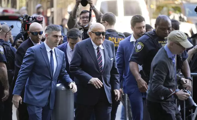 Rudy Giuliani, center, arrives to federal court in New York, Thursday, Nov. 7, 2024. (AP Photo/Seth Wenig)