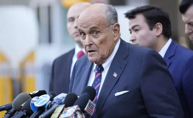 Former New York Mayor Rudy Giuliani speaks to the media as he leaves court in New York, Thursday, Nov. 7, 2024. (AP Photo/Seth Wenig)