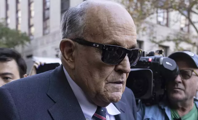 Former New York City Mayor Rudy Giuliani arrives at the court to explain to a federal judge why he hasn't surrendered his valuables as part of a $148 million defamation judgment, in New York, Thursday, Nov. 7, 2024. (AP Photo/Yuki Iwamura)