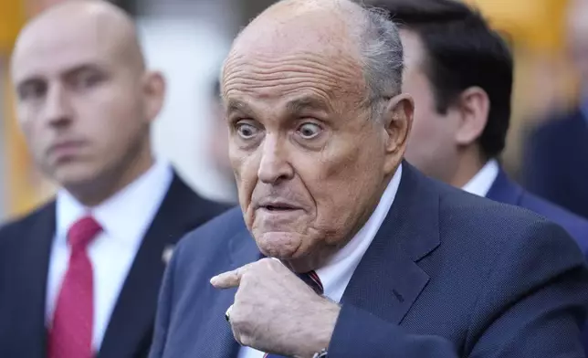 Former New York Mayor Rudy Giuliani speaks to the media as he leaves court in New York, Thursday, Nov. 7, 2024. (AP Photo/Seth Wenig)