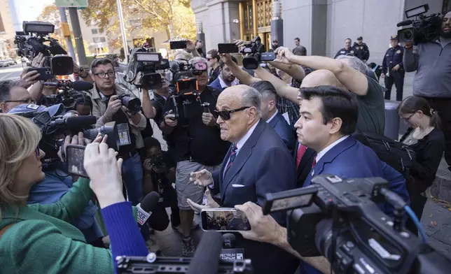 Former New York City Mayor Rudy Giuliani arrives at the court to explain to a federal judge why he hasn't surrendered his valuables as part of a $148 million defamation judgment, in New York, Thursday, Nov. 7, 2024. (AP Photo/Yuki Iwamura)