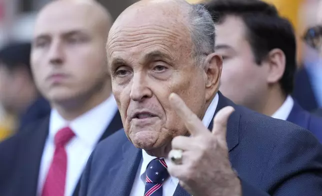 Former New York City Mayor Rudy Giuliani speaks to the media as he leaves court in New York, Thursday, Nov. 7, 2024. (AP Photo/Seth Wenig)