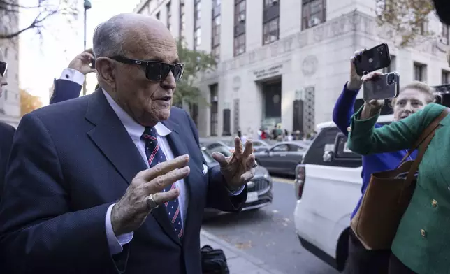 Former New York City Mayor Rudy Giuliani arrives at the court to explain to a federal judge why he hasn't surrendered his valuables as part of a $148 million defamation judgment, in New York, Thursday, Nov. 7, 2024. (AP Photo/Yuki Iwamura)