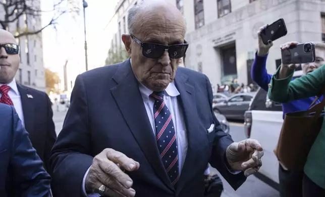 Former New York City Mayor Rudy Giuliani arrives at the court to explain to a federal judge why he hasn't surrendered his valuables as part of a $148 million defamation judgment, in New York, Thursday, Nov. 7, 2024. (AP Photo/Yuki Iwamura)