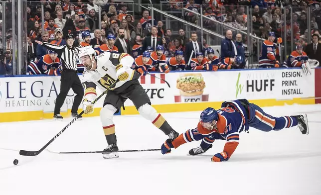 Vegas Golden Knights' Mark Stone (61) get the open net goal as Edmonton Oilers' Connor McDavid (97) tries to stop him during the third period of an NHL hockey game Wednesday, Nov. 6, 2024 in Edmonton, Alberta. (Jason Franson/The Canadian Press via AP)