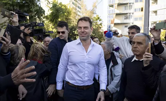 Stefanos Kasselakis, center, a political neophyte who led main opposition SYRIZA party for a year following a stinging election defeat in 2023, is cheered by supporters ahead of an announcement for a new political formation, in Athens, Greece, Saturday, Nov. 9, 2024. (AP Photo/Yorgos Karahalis)