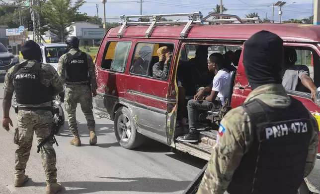 Police officers patrol near the Toussaint Louverture International Airport in Port-au-Prince, Haiti, Tuesday, Nov. 12, 2024. (AP Photo/Odelyn Joseph)