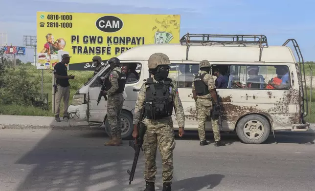 Police officers patrol near the Toussaint Louverture International Airport in Port-au-Prince, Haiti, Tuesday, Nov. 12, 2024. (AP Photo/Odelyn Joseph)