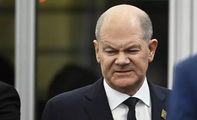 Germany's Chancellor Olaf Scholz arrives for a plenary session during an EU Summit at the Puskas Arena in Budapest, Friday, Nov. 8, 2024. (AP Photo/Denes Erdos)