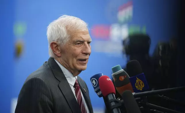 European Union foreign policy chief Josep Borrell speaks with the media as he arrives for an EU Summit at the Puskas Arena in Budapest, Hungary, Friday, Nov. 8, 2024. (AP Photo/Petr David Josek)